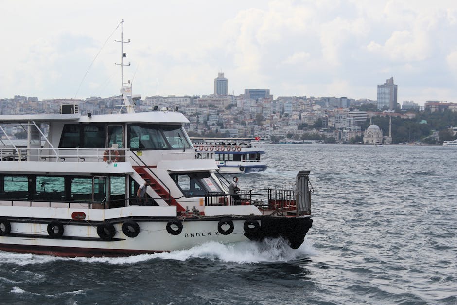 Ferry cruising across the Bosphorus with Istanbul's skyline in the background.